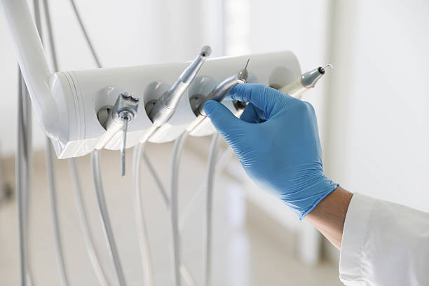 Professional Emergency Dentist technician working in Massapequa Park, NY